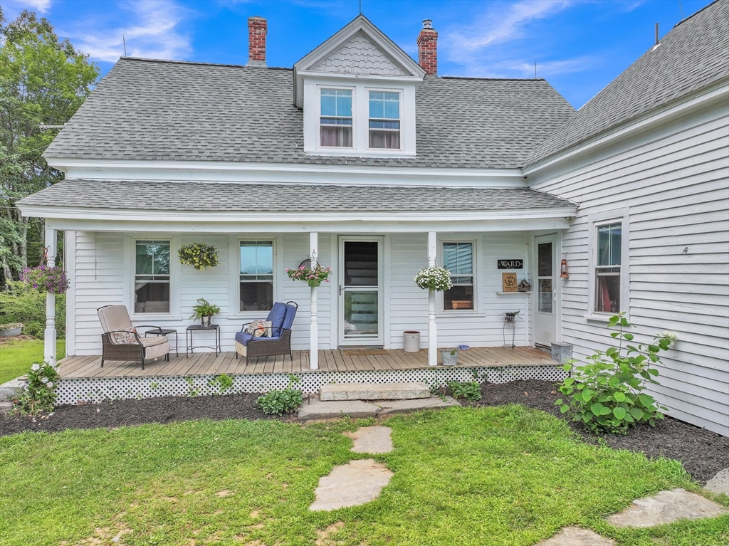 665 Thresher Road Hardwick, MA 01037 - Photo 5 of 41 a front view of a house with a yard and patio