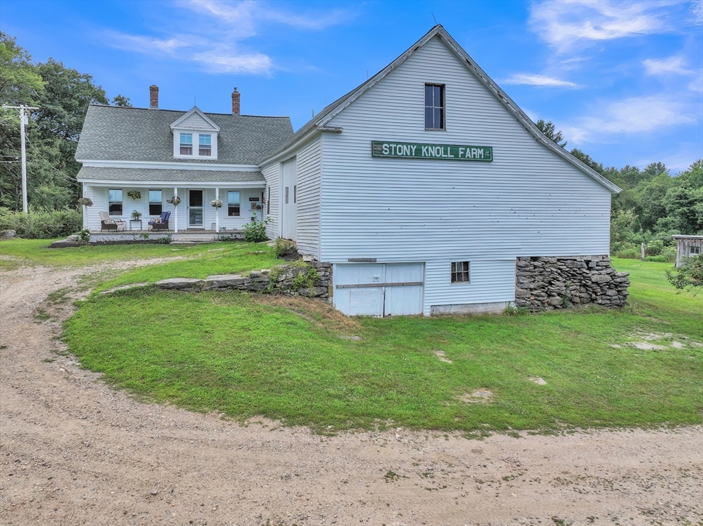 665 Thresher Road Hardwick, MA 01037 - Photo 6 of 41 a front view of house with garden