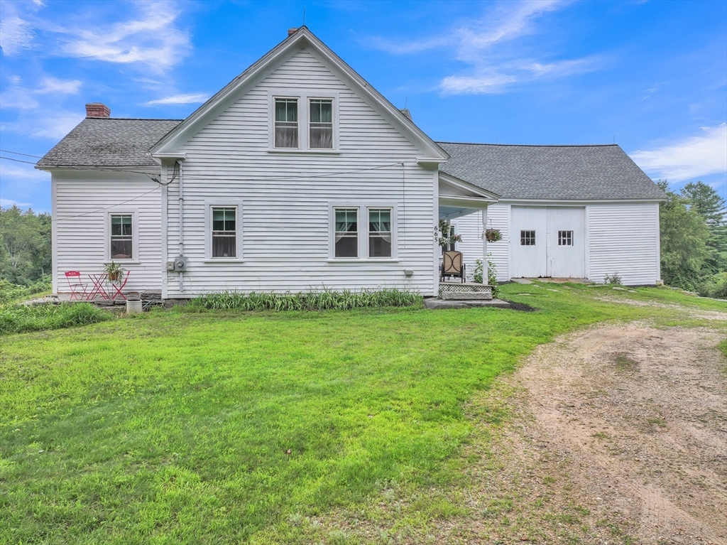 665 Thresher Road Hardwick, MA 01037 - Photo 7 of 41 a front view of house with yard and green space