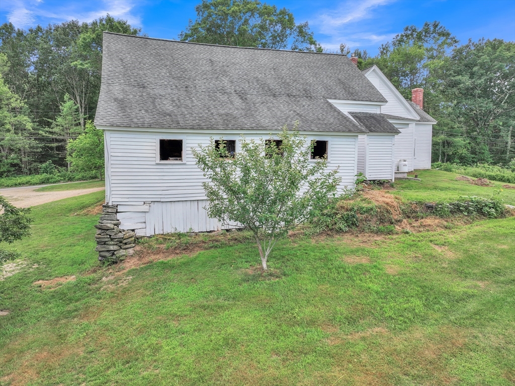 665 Thresher Road Hardwick, MA 01037 - Photo 9 of 41 a aerial view of a house next to a big yard and large trees