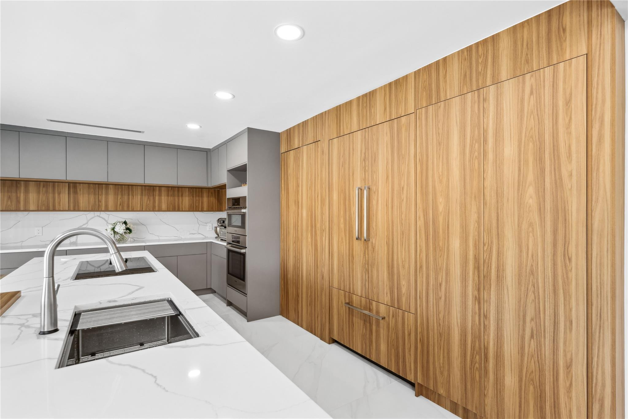 2901 Northeast 46th Street Lighthouse Point, FL 33064 - Photo 28 of 79 a white kitchen with a sink and a stove top oven