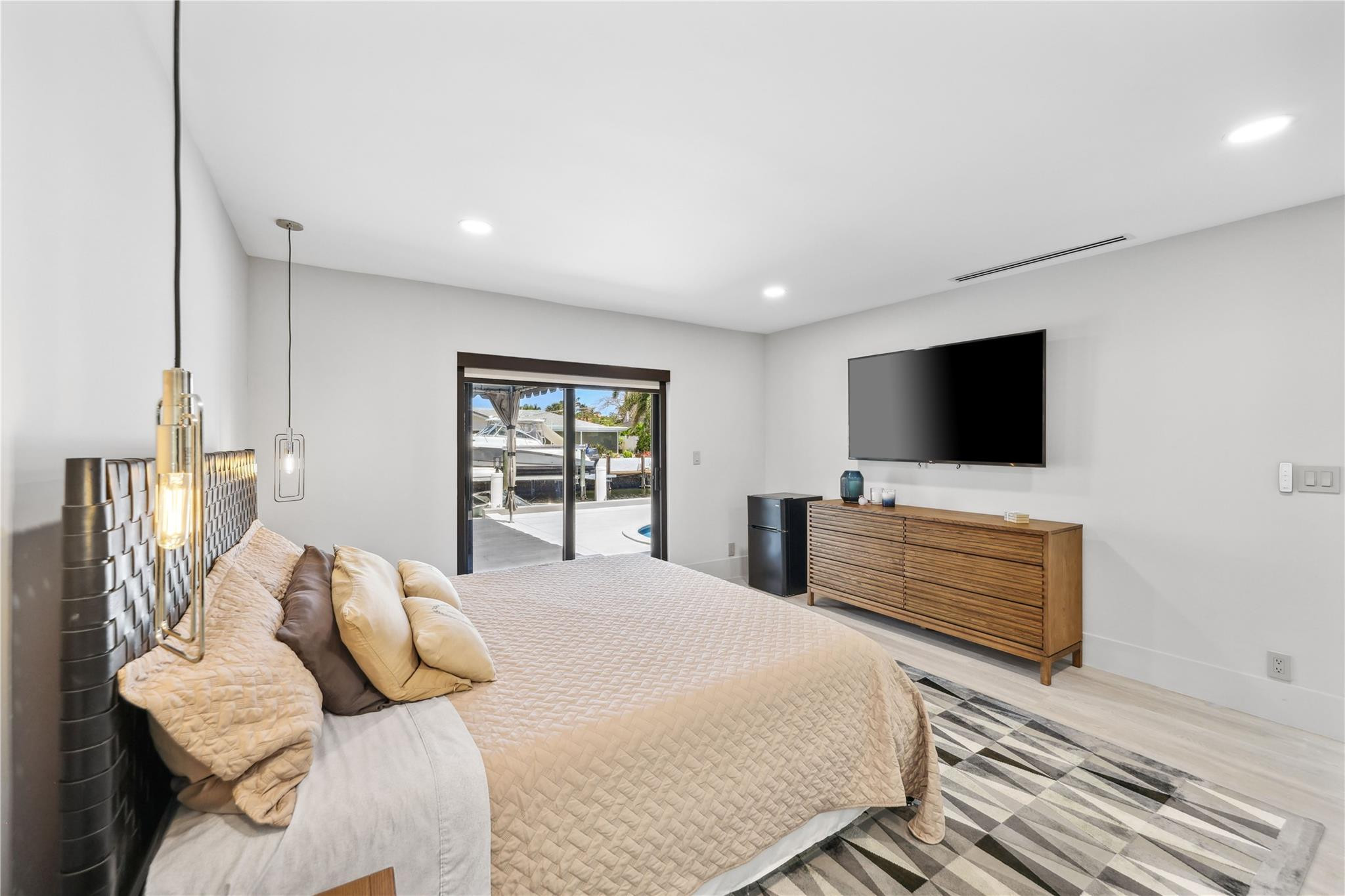 2901 Northeast 46th Street Lighthouse Point, FL 33064 - Photo 36 of 79 a bedroom with a bed and a flat screen tv