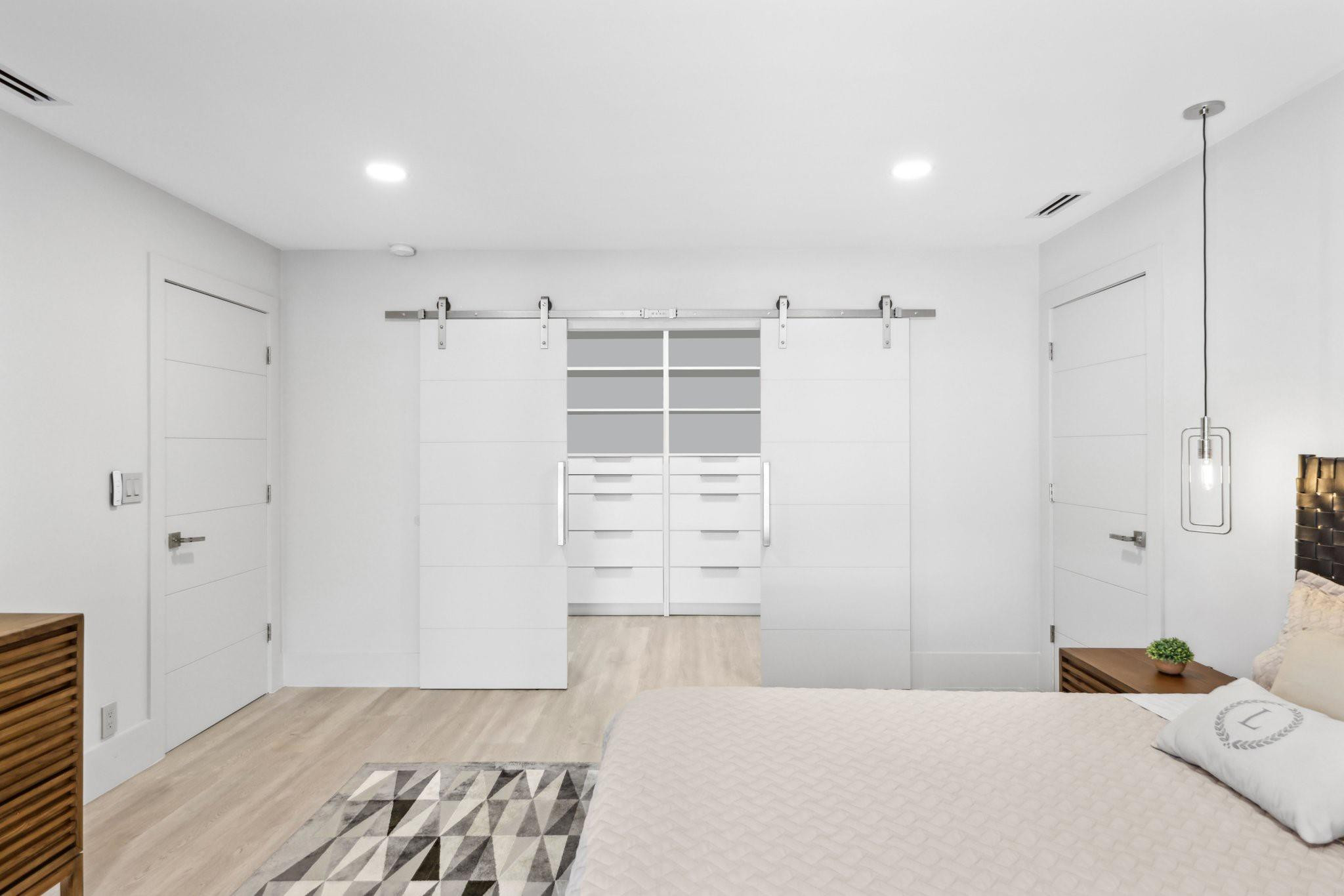 2901 Northeast 46th Street Lighthouse Point, FL 33064 - Photo 37 of 79 a bedroom with a bed and a walk in closet