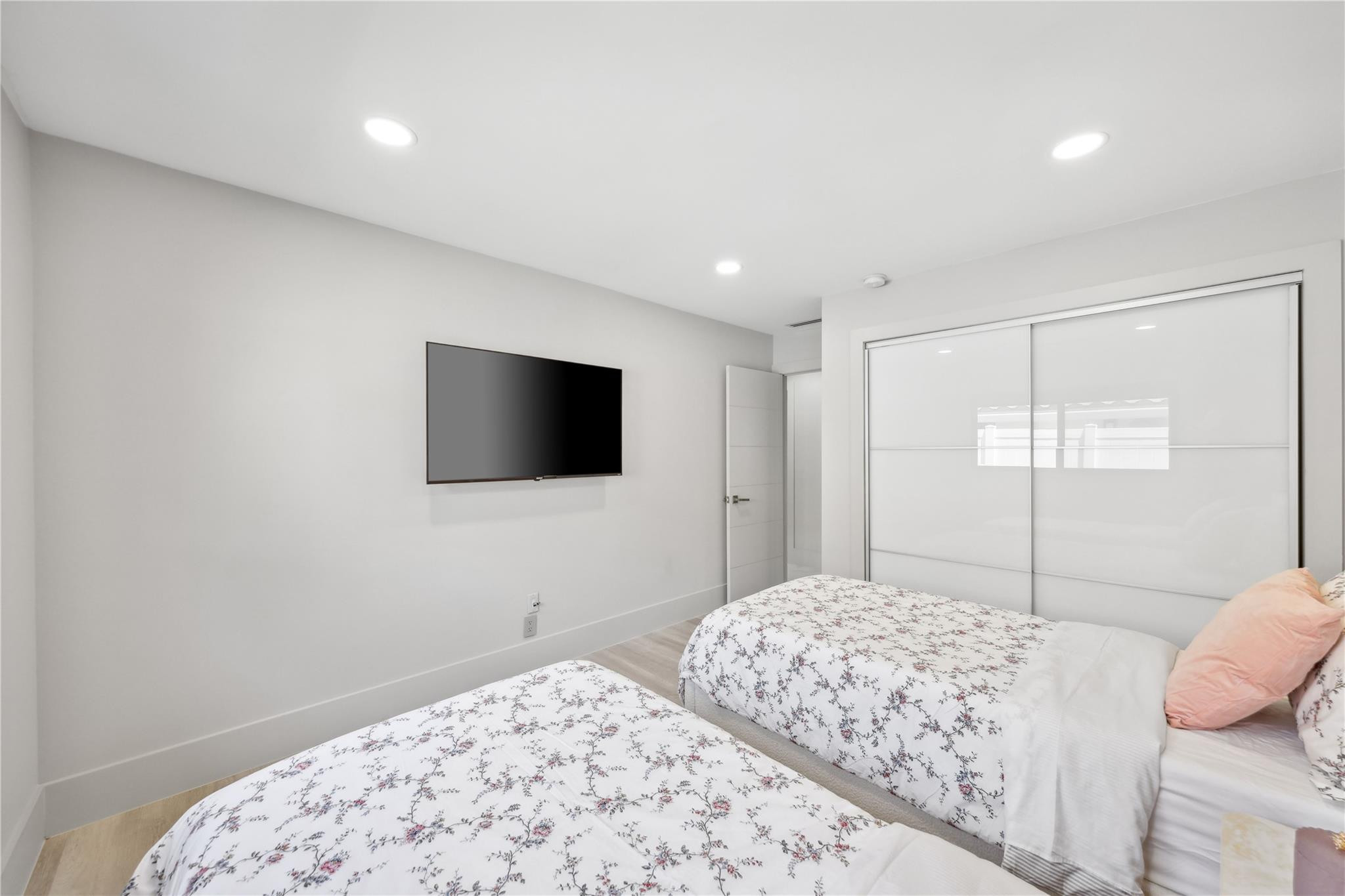 2901 Northeast 46th Street Lighthouse Point, FL 33064 - Photo 46 of 79 a bedroom with a bed and a flat screen tv