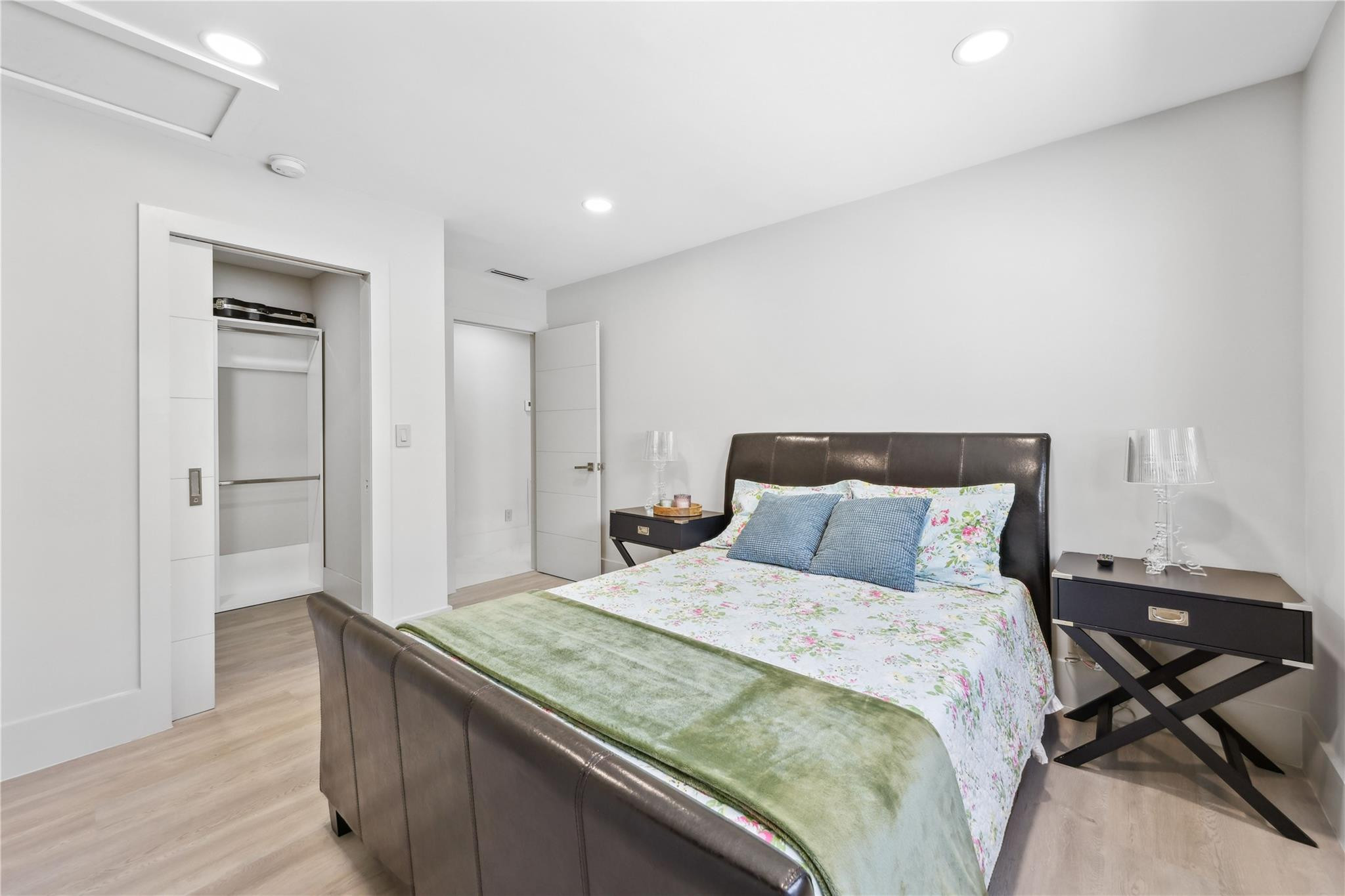 2901 Northeast 46th Street Lighthouse Point, FL 33064 - Photo 48 of 79 a bedroom with a bed and wooden floor