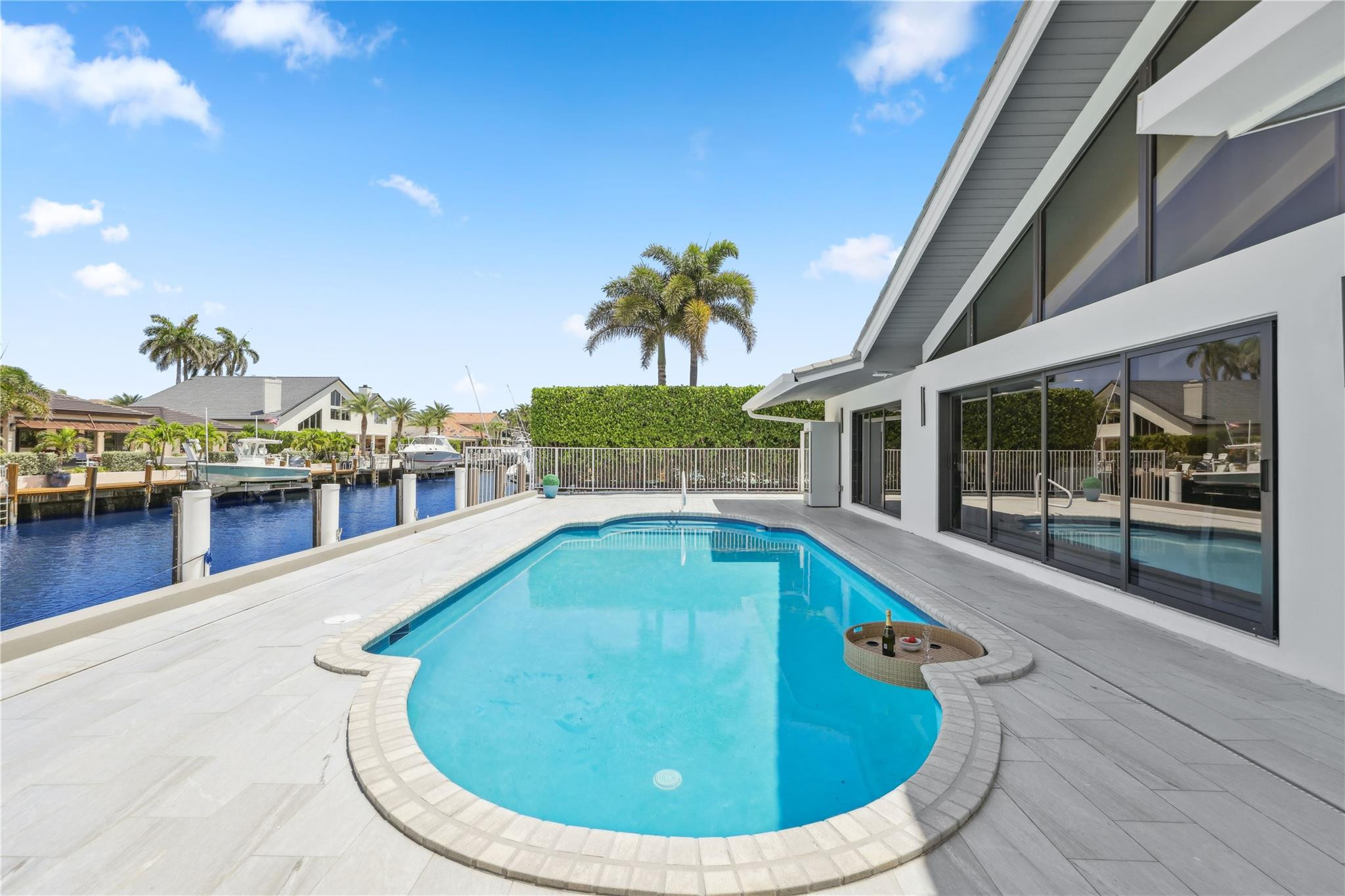 2901 Northeast 46th Street Lighthouse Point, FL 33064 - Photo 57 of 79 a view of a swimming pool with an outdoor seating
