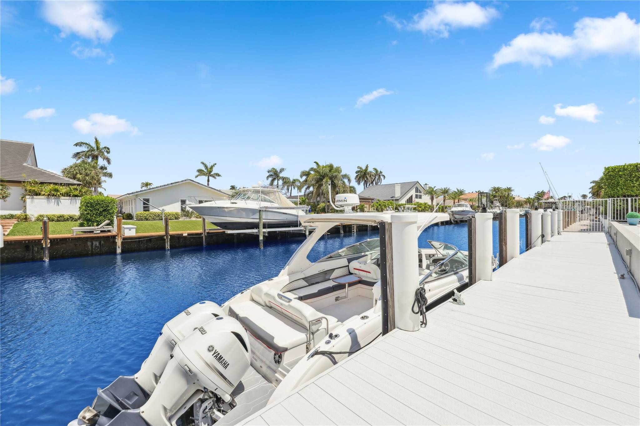 2901 Northeast 46th Street Lighthouse Point, FL 33064 - Photo 61 of 79 a roof deck with table and chairs a barbeque with potted plants