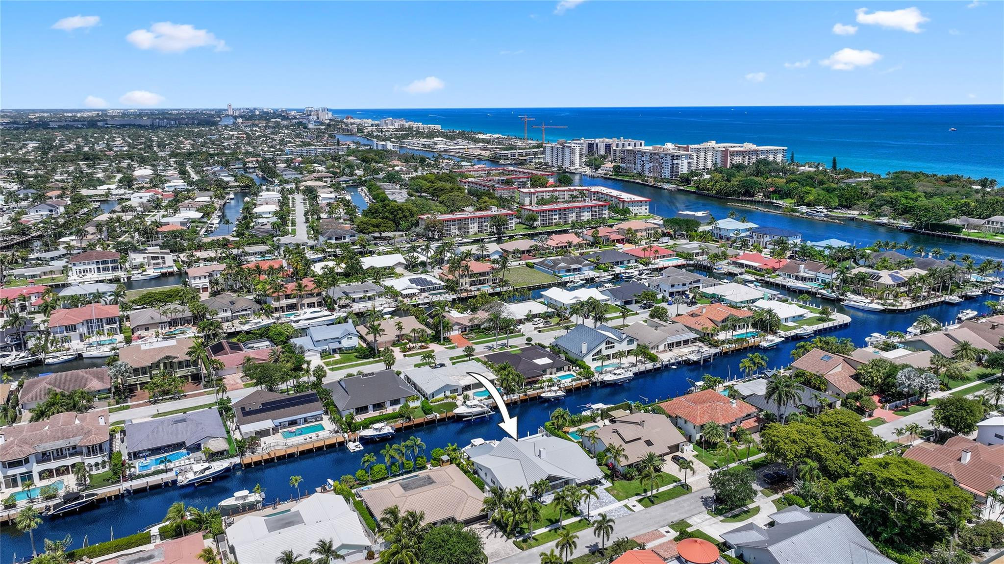 2901 Northeast 46th Street Lighthouse Point, FL 33064 - Photo 70 of 79 an aerial view of a city with lots of residential buildings and ocean view in back