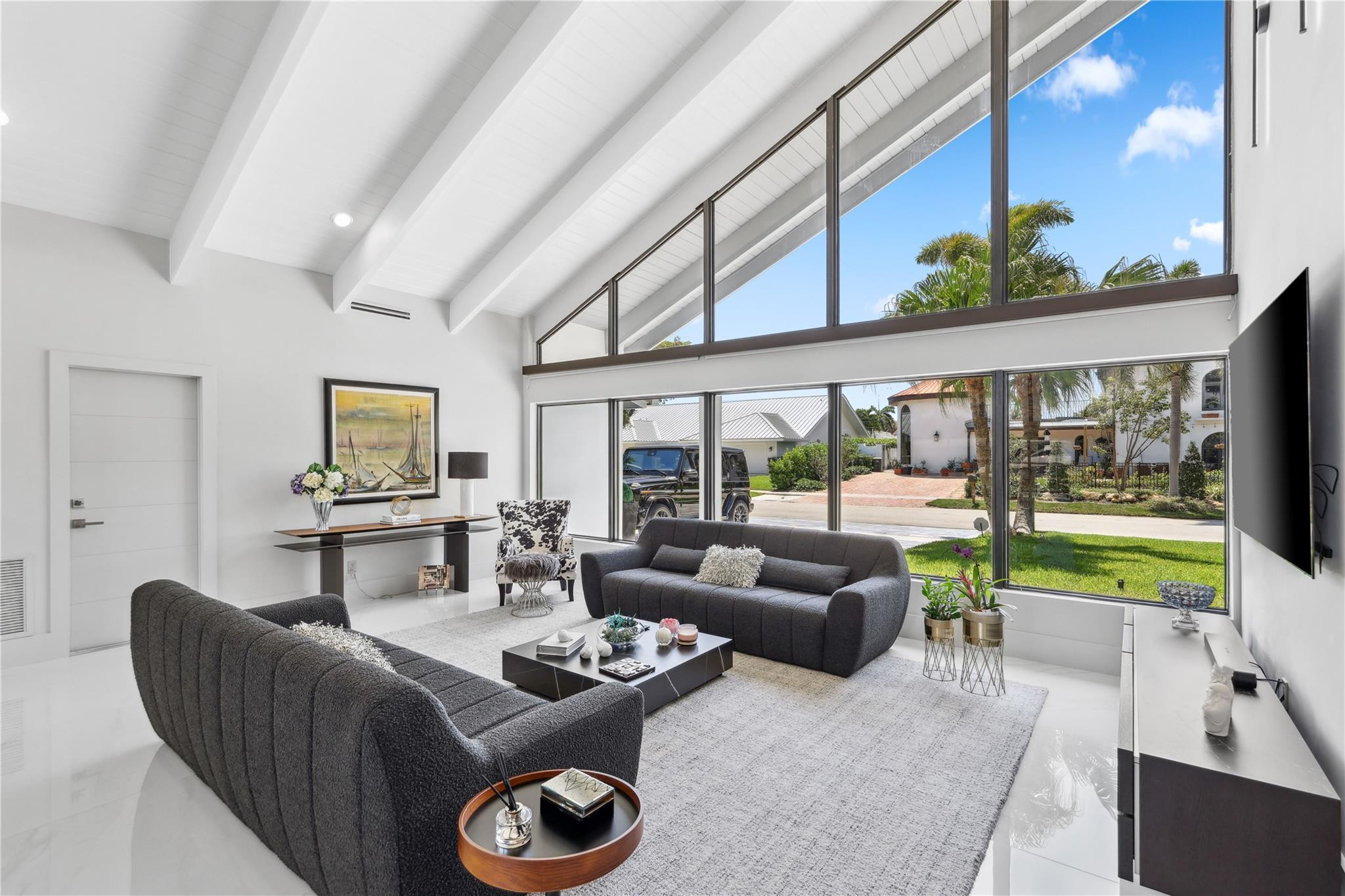 2901 Northeast 46th Street Lighthouse Point, FL 33064 - Photo 7 of 79 a living room with furniture and a floor to ceiling window