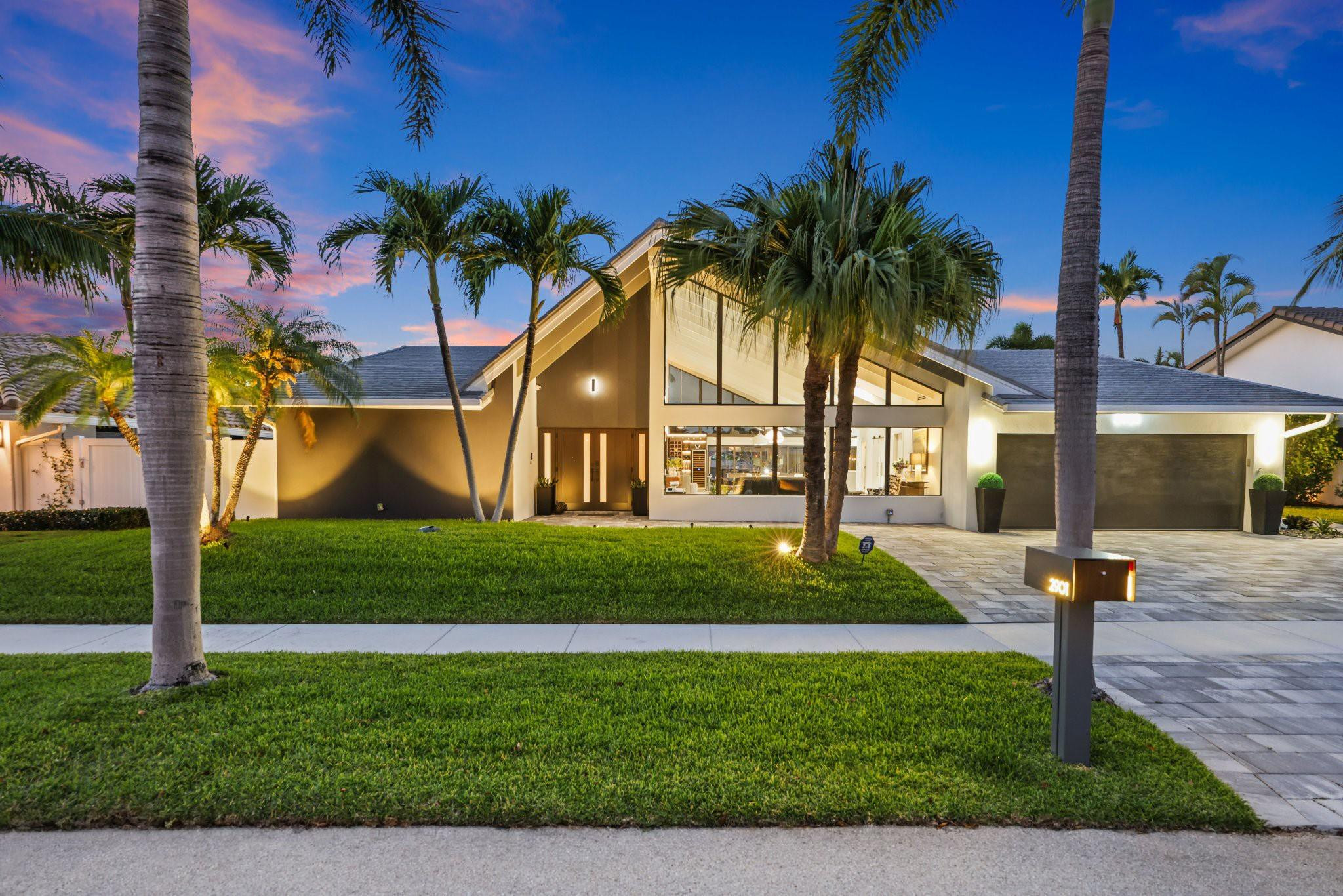 2901 Northeast 46th Street Lighthouse Point, FL 33064 - Photo 73 of 79 a front view of a house with garden