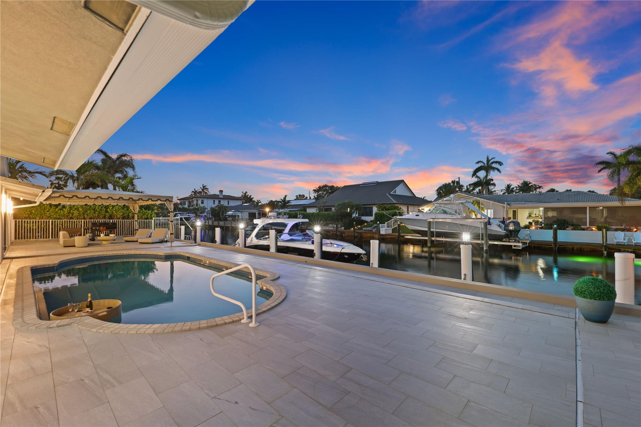 2901 Northeast 46th Street Lighthouse Point, FL 33064 - Photo 74 of 79 a view of a swimming pool with outdoor seating