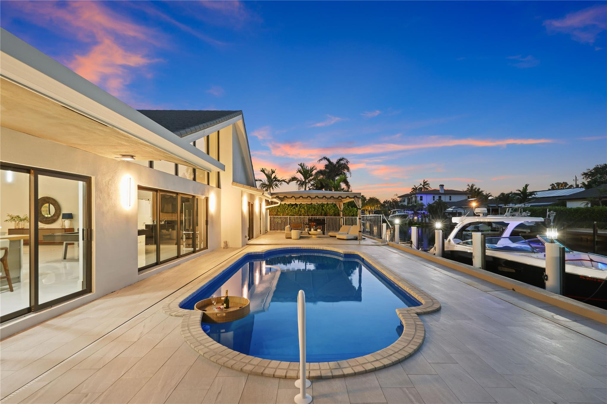 2901 Northeast 46th Street Lighthouse Point, FL 33064 - Photo 75 of 79 a view of a swimming pool with a lounge chair