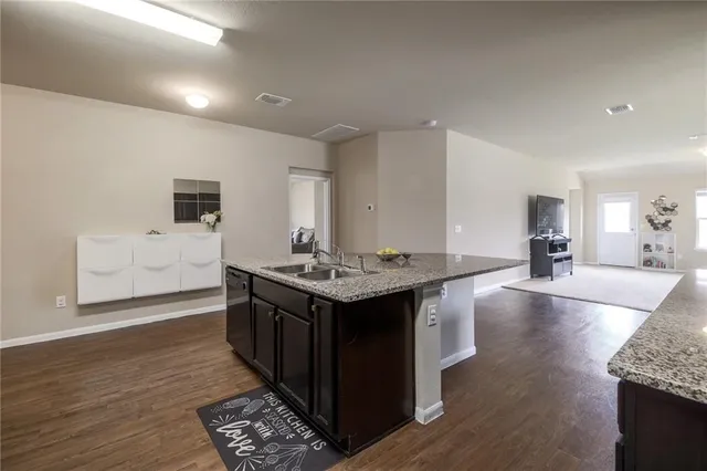 a kitchen with a stove and a sink