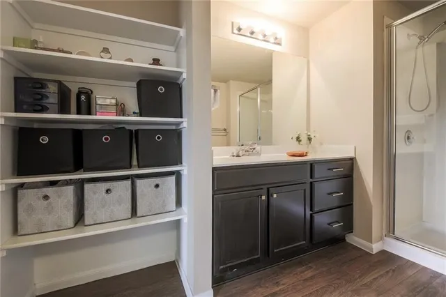 a bathroom with a double vanity sink and mirror