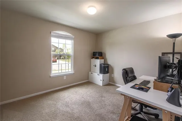 a workspace with furniture and window