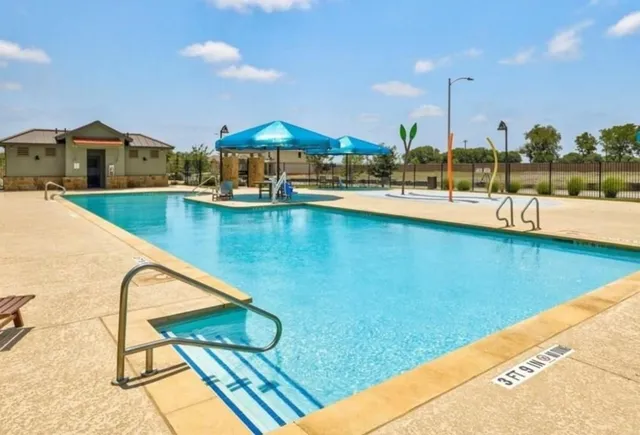 a view of swimming pool from a balcony