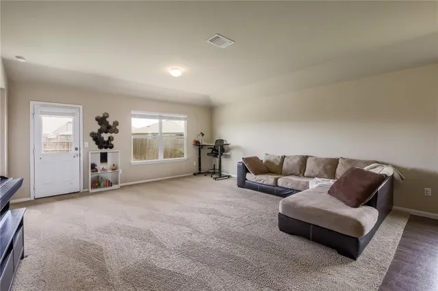 a living room with furniture and window