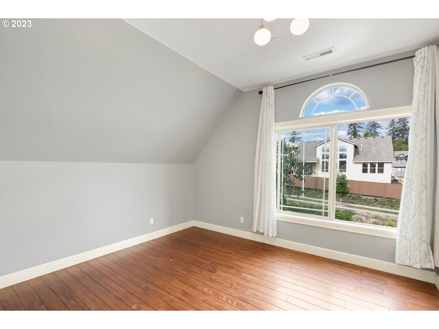 6136 Northwest Larkspur Street Camas, WA 98607 - Photo 20 of 40 wooden floor in an empty room with a window