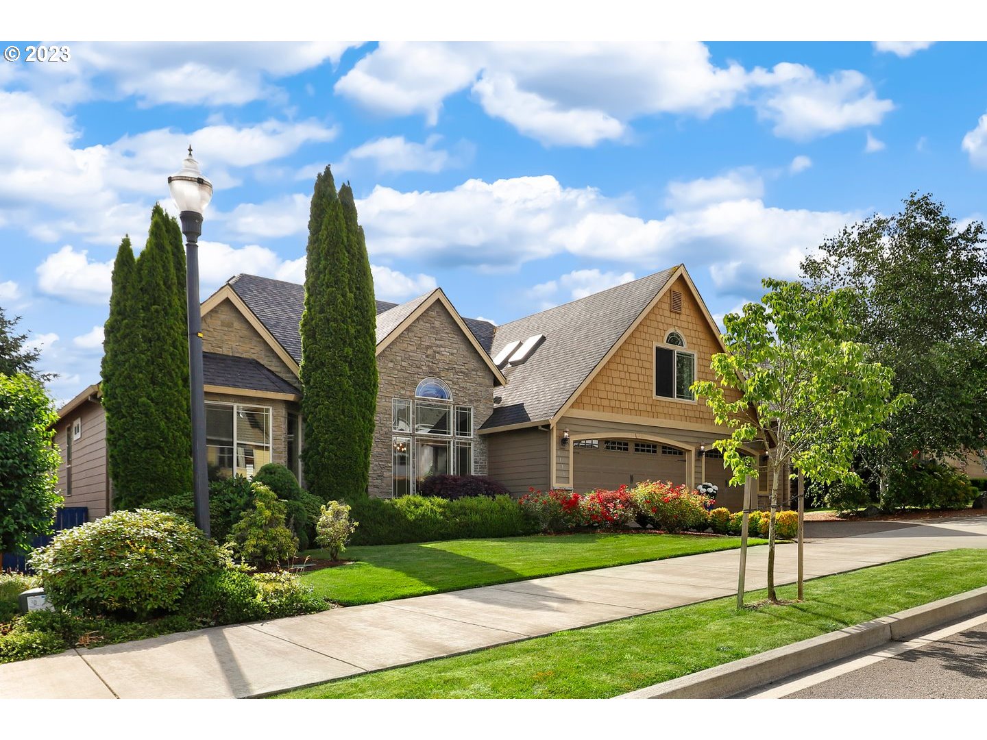 6136 Northwest Larkspur Street Camas, WA 98607 - Photo 2 of 40 a front view of a house with a yard