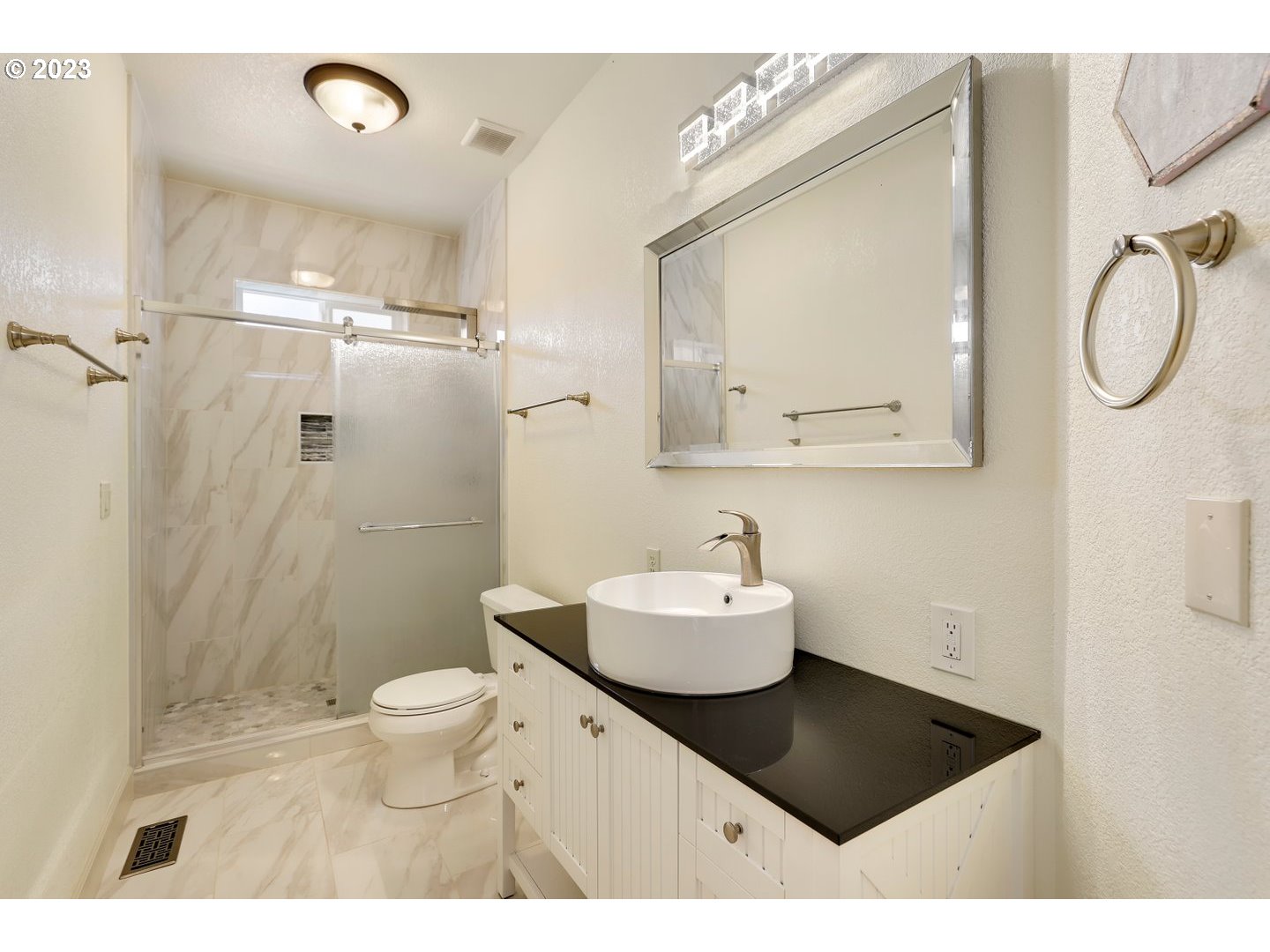 6136 Northwest Larkspur Street Camas, WA 98607 - Photo 28 of 40 a bathroom with a sink a toilet and a mirror