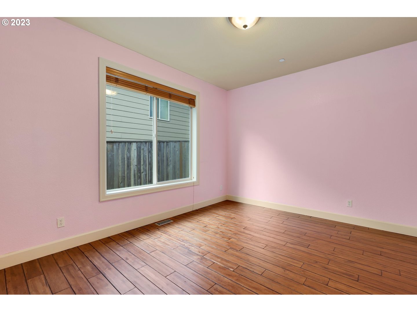 6136 Northwest Larkspur Street Camas, WA 98607 - Photo 29 of 40 a view of an empty room with wooden floor and a window