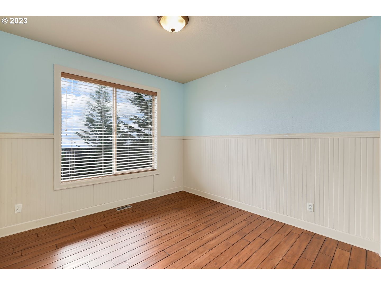 6136 Northwest Larkspur Street Camas, WA 98607 - Photo 31 of 40 a view of an empty room with wooden floor and a window