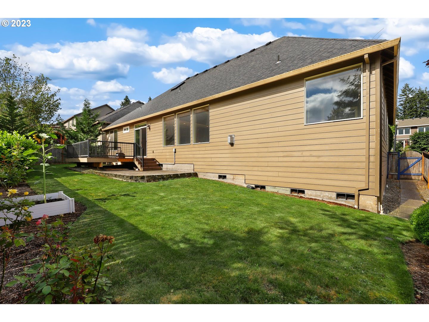 6136 Northwest Larkspur Street Camas, WA 98607 - Photo 36 of 40 a front view of a house with a garden and yard