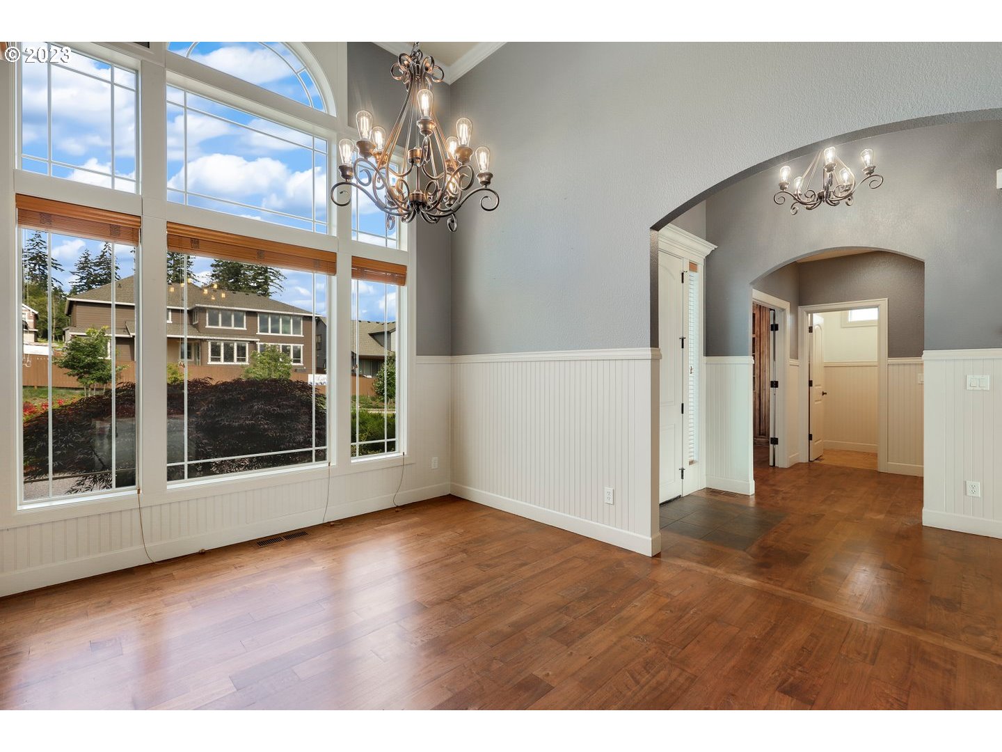 6136 Northwest Larkspur Street Camas, WA 98607 - Photo 5 of 40 a view of a room with chandelier fan and wooden floor