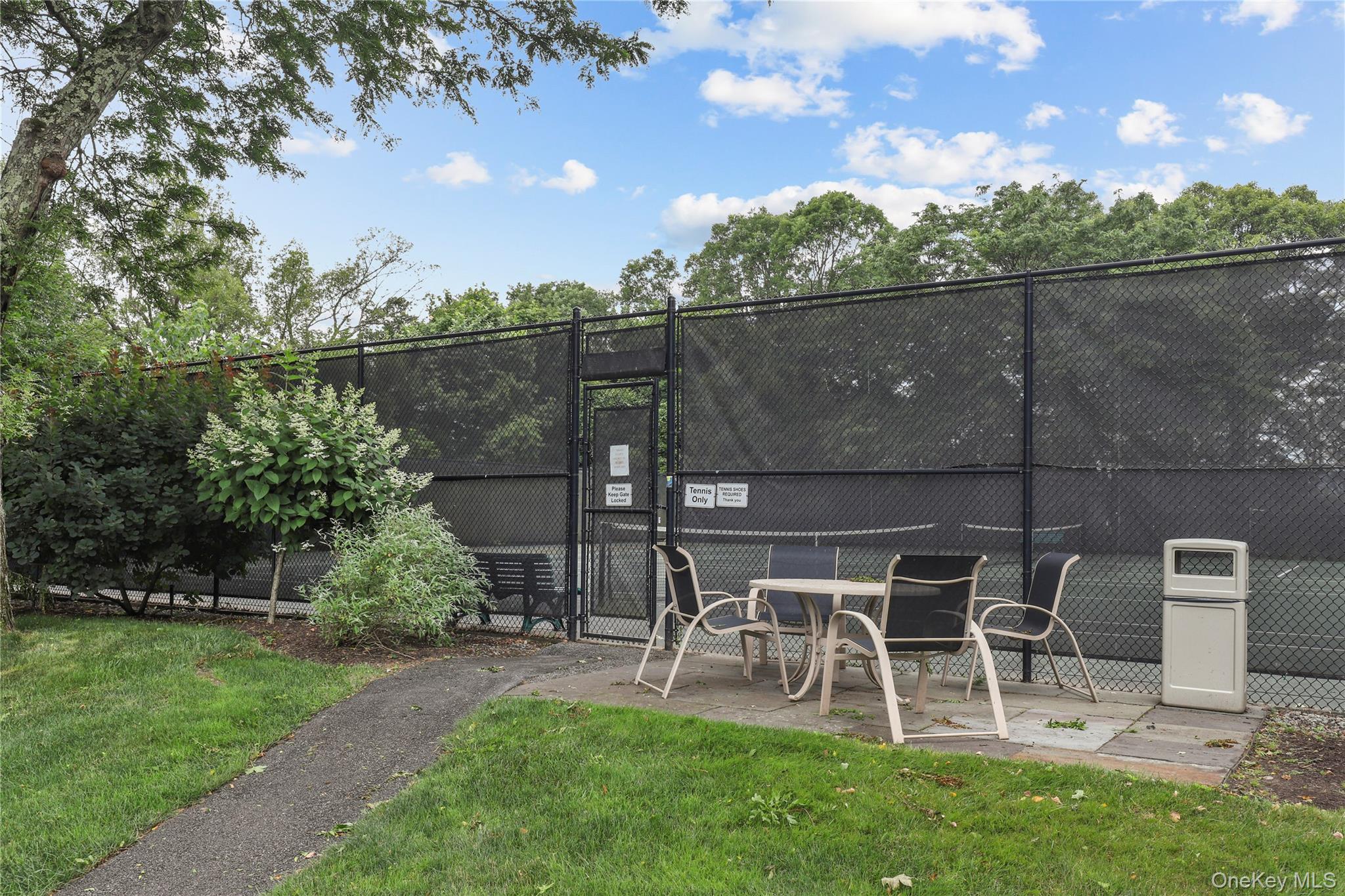 150 Overlook Avenue, Unit 6L Peekskill, NY 10566 - Photo 17 of 18 a view of a chairs and table in backyard
