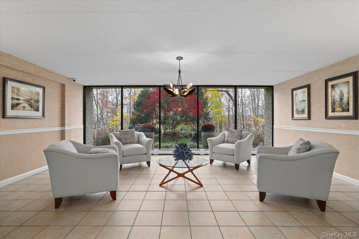 150 Overlook Avenue, Unit 6L Peekskill, NY 10566 - Photo 3 of 18 a living room with furniture and a large window