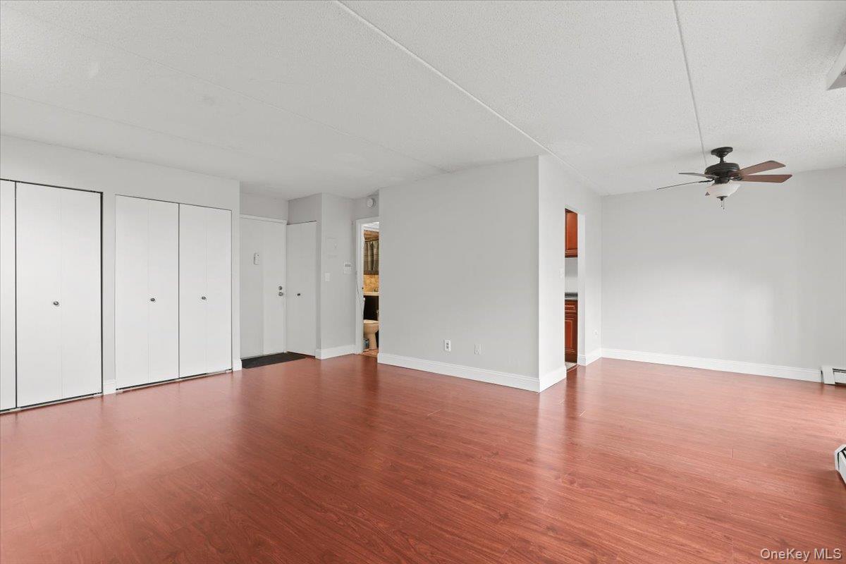 150 Overlook Avenue, Unit 6L Peekskill, NY 10566 - Photo 5 of 18 a view of an empty room with a ceiling fan