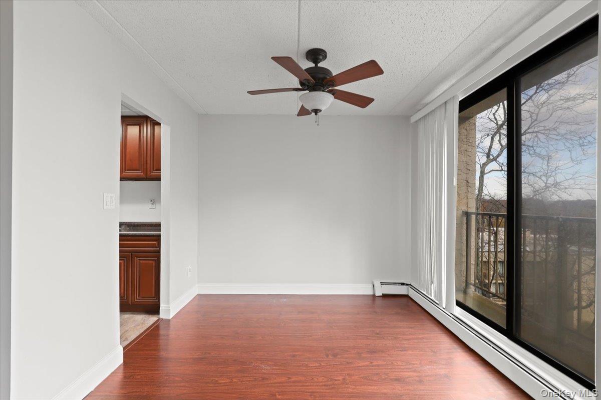 150 Overlook Avenue, Unit 6L Peekskill, NY 10566 - Photo 8 of 18 wooden floor in an empty room with a window