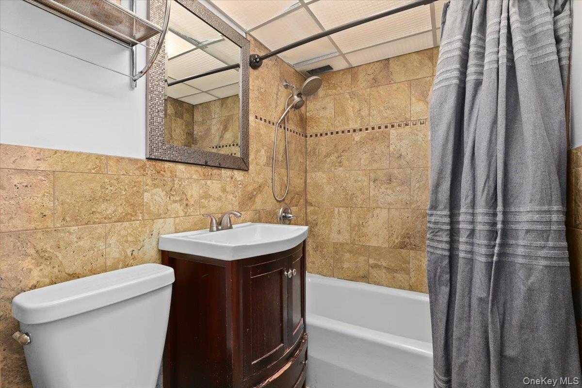 150 Overlook Avenue, Unit 6L Peekskill, NY 10566 - Photo 10 of 18 a bathroom with a sink a toilet and shower