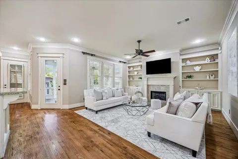 an open kitchen with white cabinets and stainless steel appliances