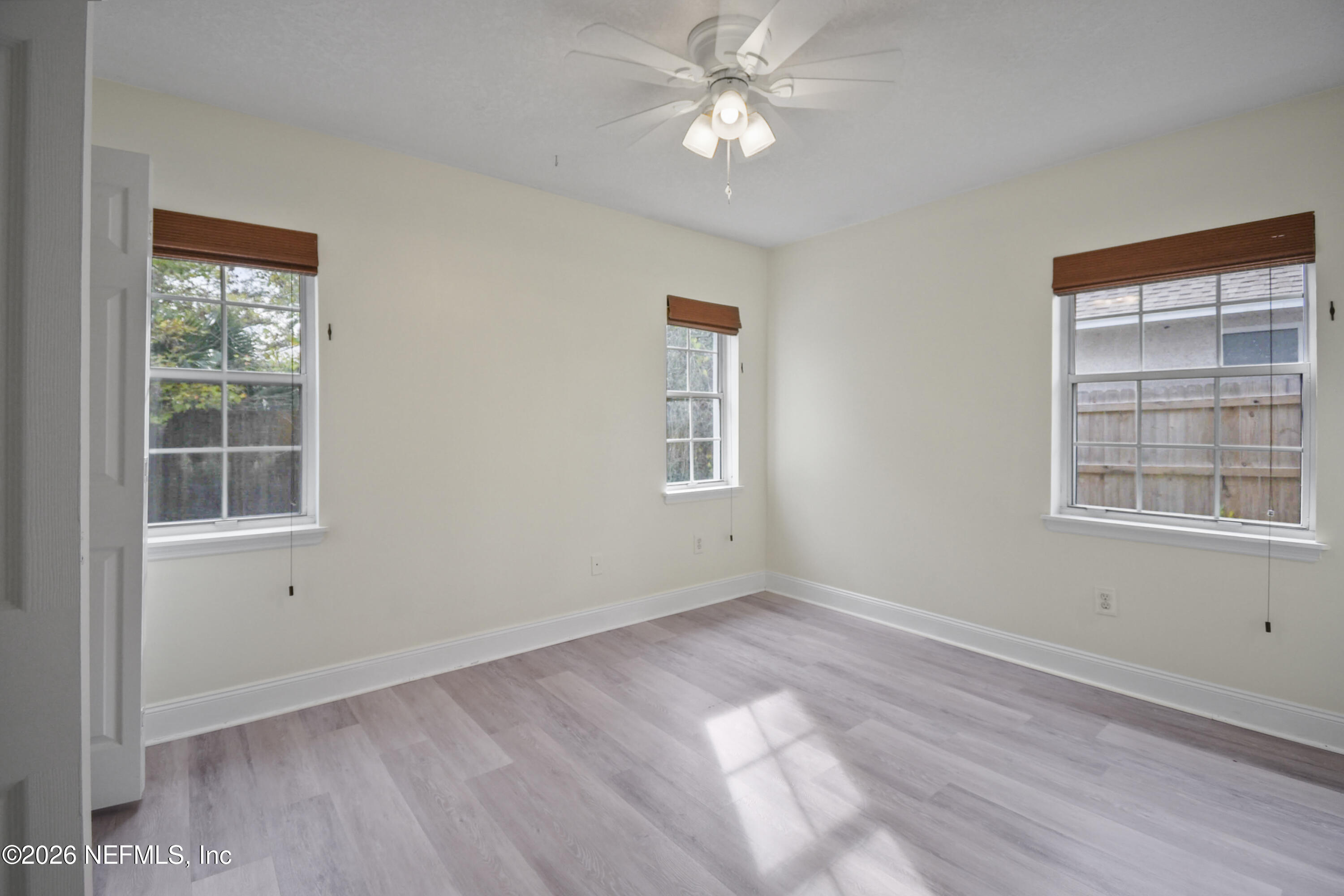 303 D Street St. Augustine Beach, FL 32080 - Photo 17 of 39 a view of empty room with wooden floor and fan