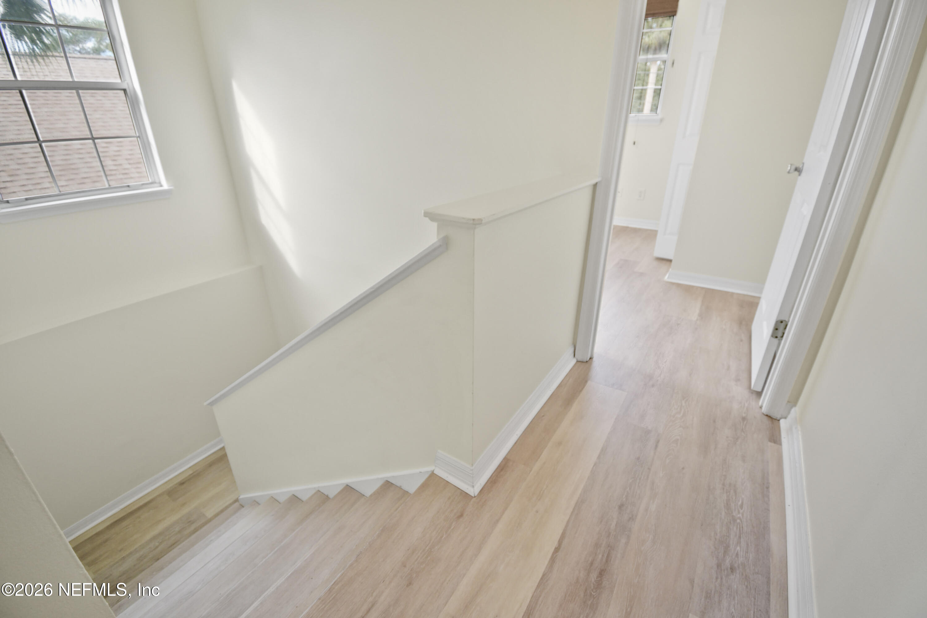 303 D Street St. Augustine Beach, FL 32080 - Photo 22 of 39 a view of a hallway with wooden floor and entryway