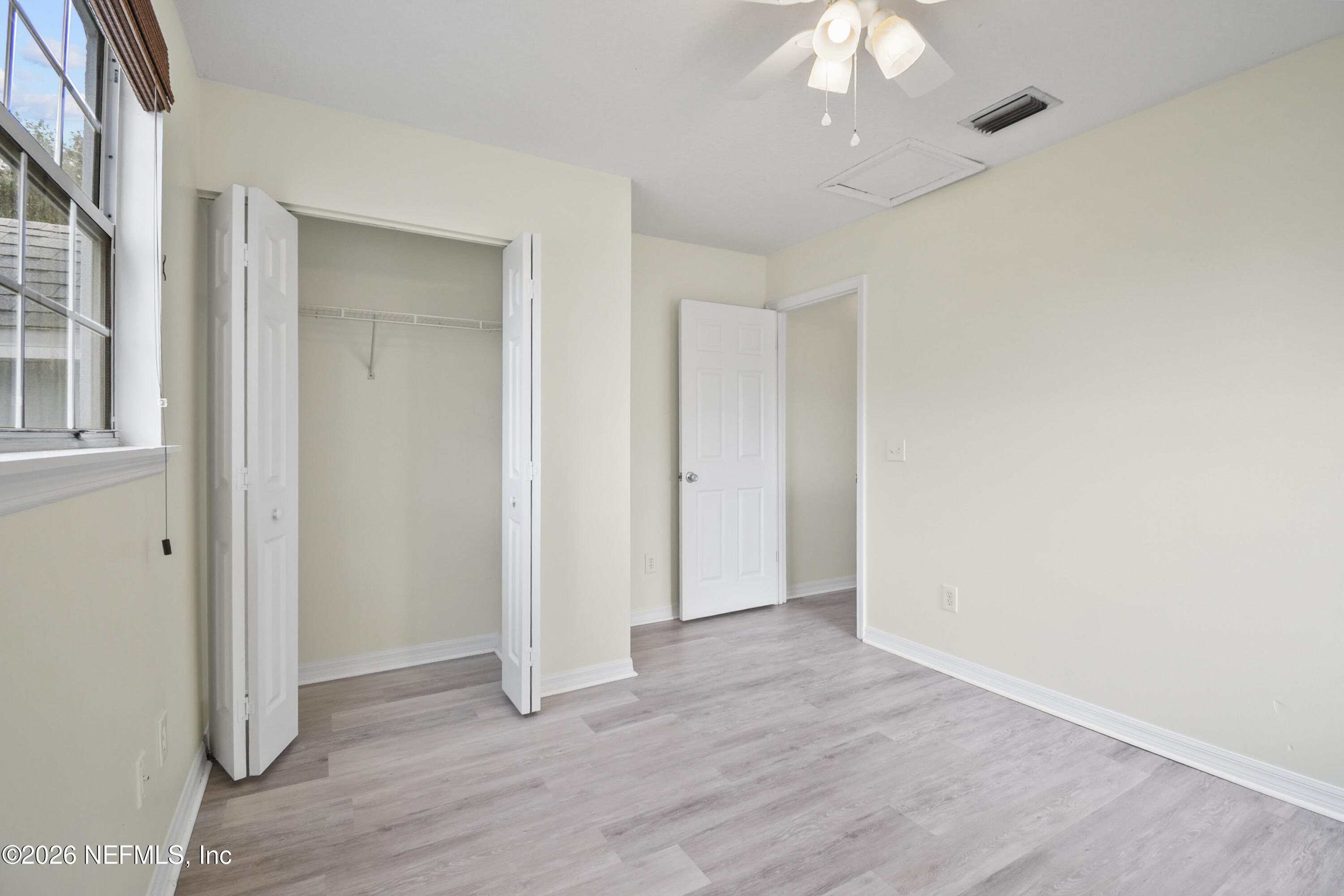 303 D Street St. Augustine Beach, FL 32080 - Photo 28 of 39 a view of an empty room with wooden floor