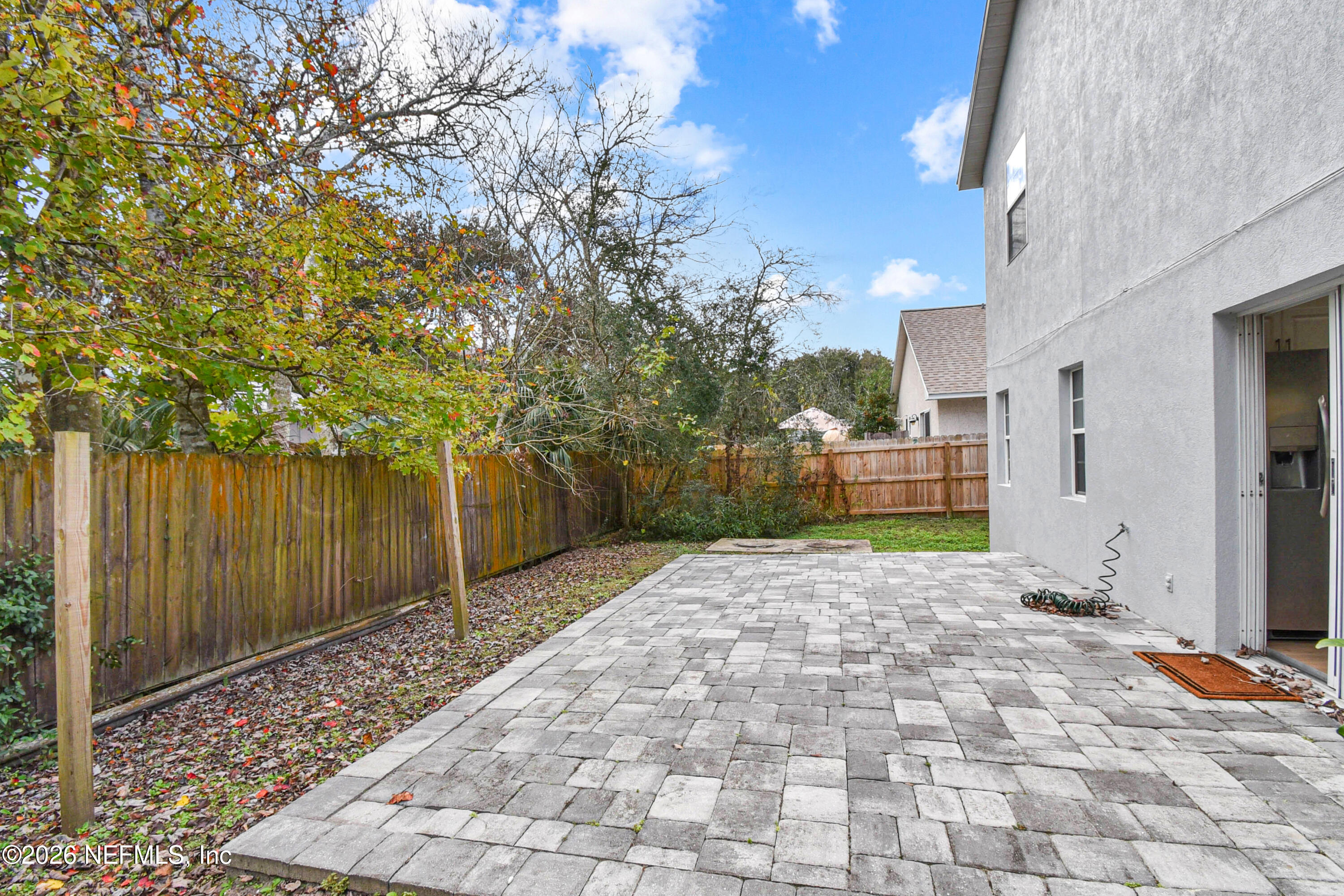 303 D Street St. Augustine Beach, FL 32080 - Photo 32 of 39 a view of a pathway with a yard