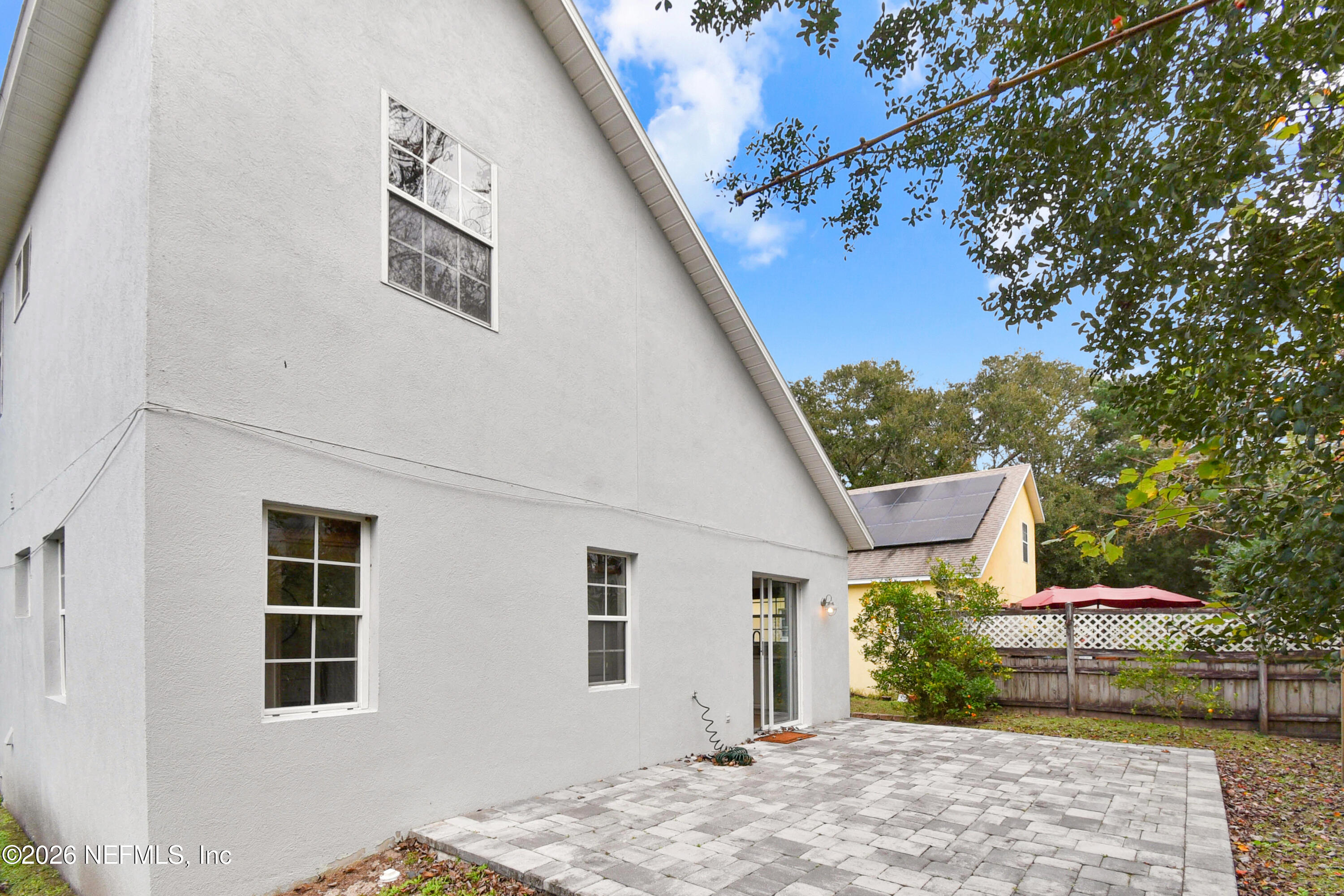 303 D Street St. Augustine Beach, FL 32080 - Photo 34 of 39 a view of a house with a backyard