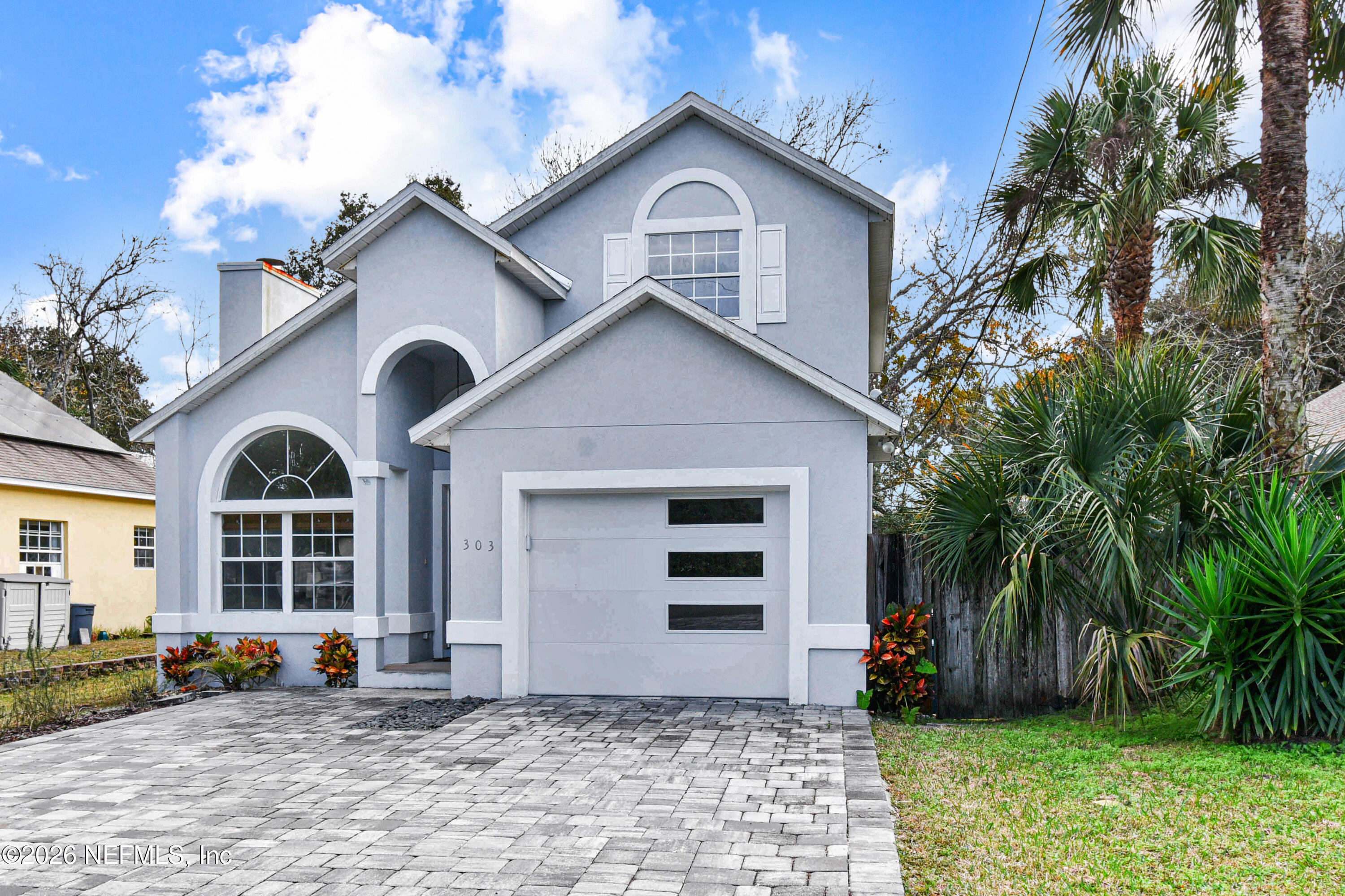 303 D Street St. Augustine Beach, FL 32080 - Photo 4 of 39 a front view of a house with a yard