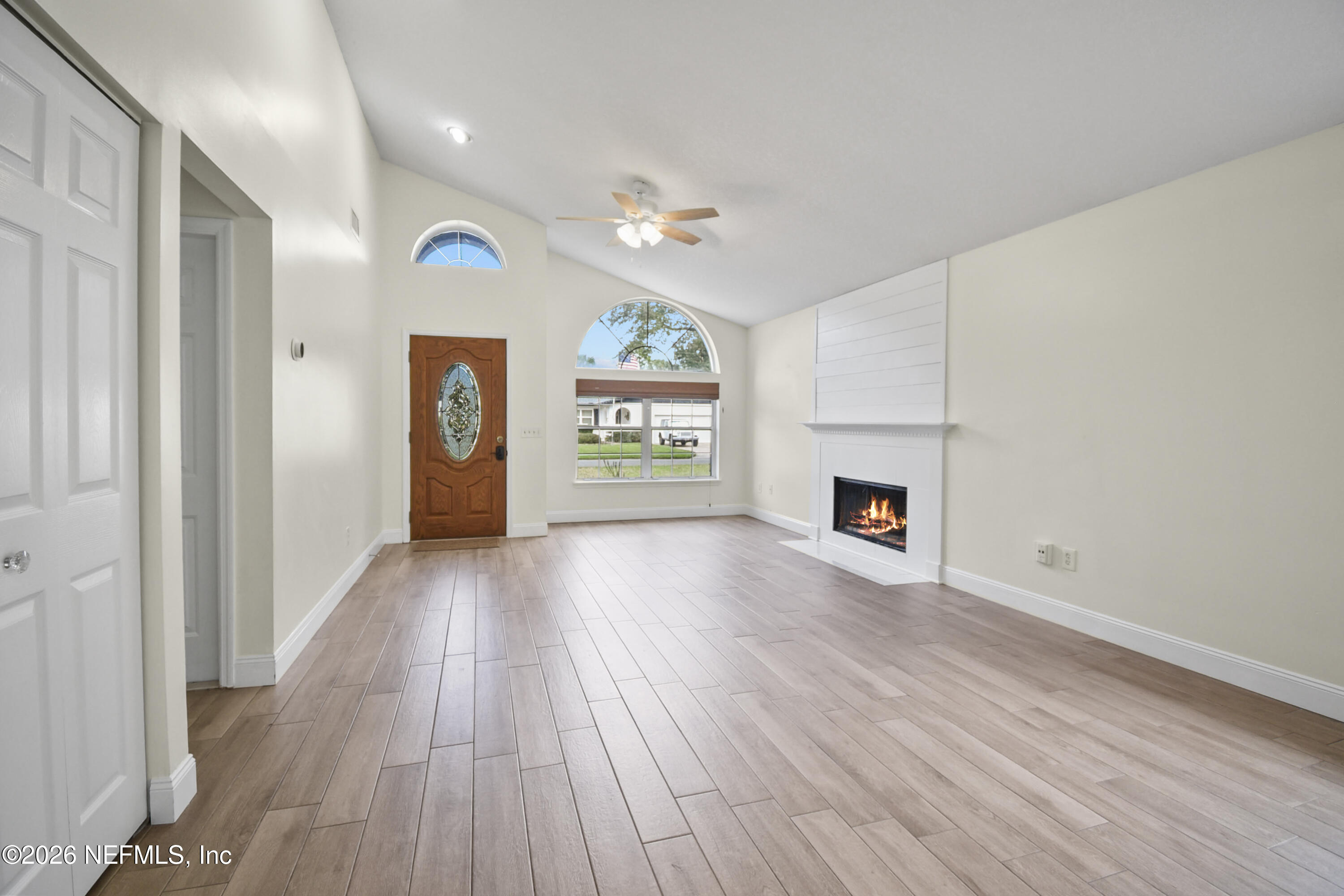303 D Street St. Augustine Beach, FL 32080 - Photo 8 of 39 wooden floor in an empty room with a window