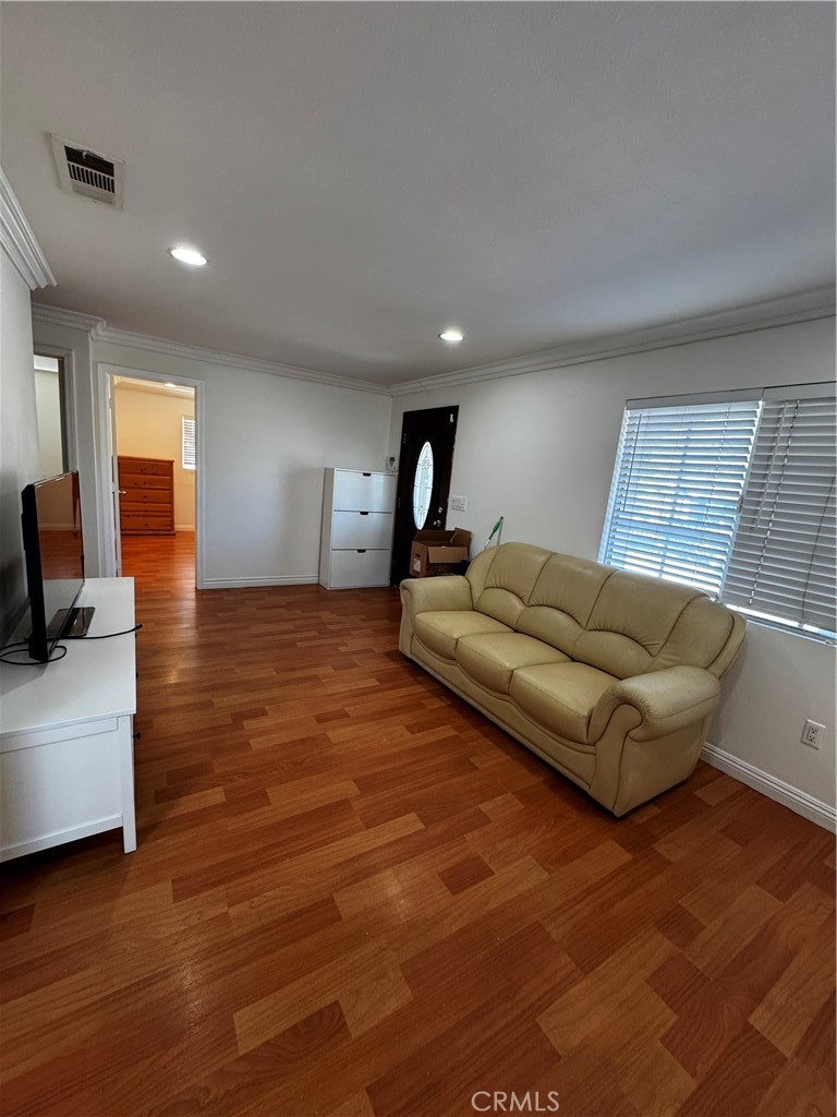 4234 Center Street Baldwin Park, CA 91706 - Photo 3 of 19 a living room with furniture and a flat screen tv