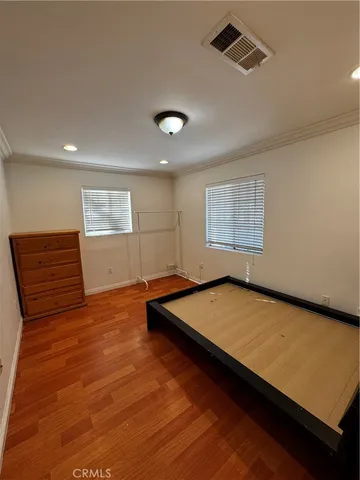 a room with pool table and windows