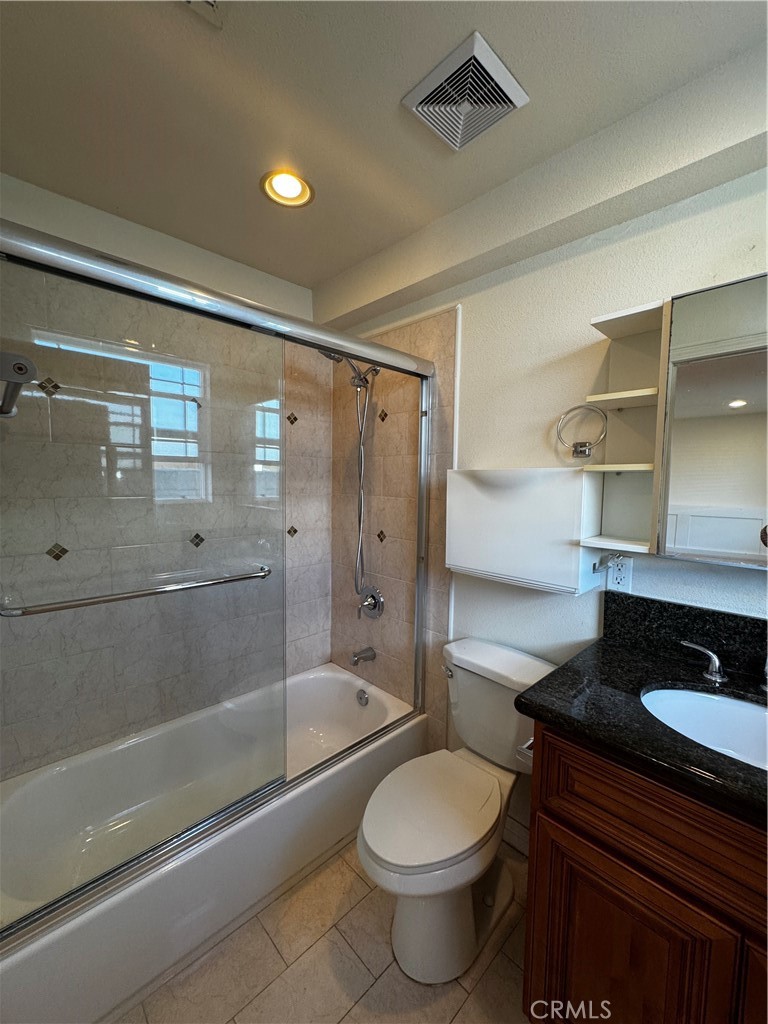 4234 Center Street Baldwin Park, CA 91706 - Photo 8 of 19 a bathroom with a granite countertop sink toilet and shower