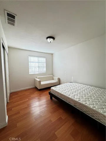 a bedroom with bed and window