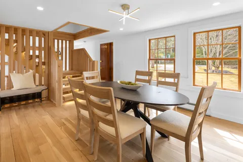 a view of a dining room with furniture window and outside view