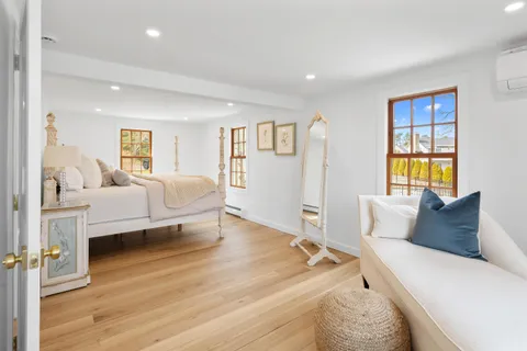 a bedroom with a bed and a couch
