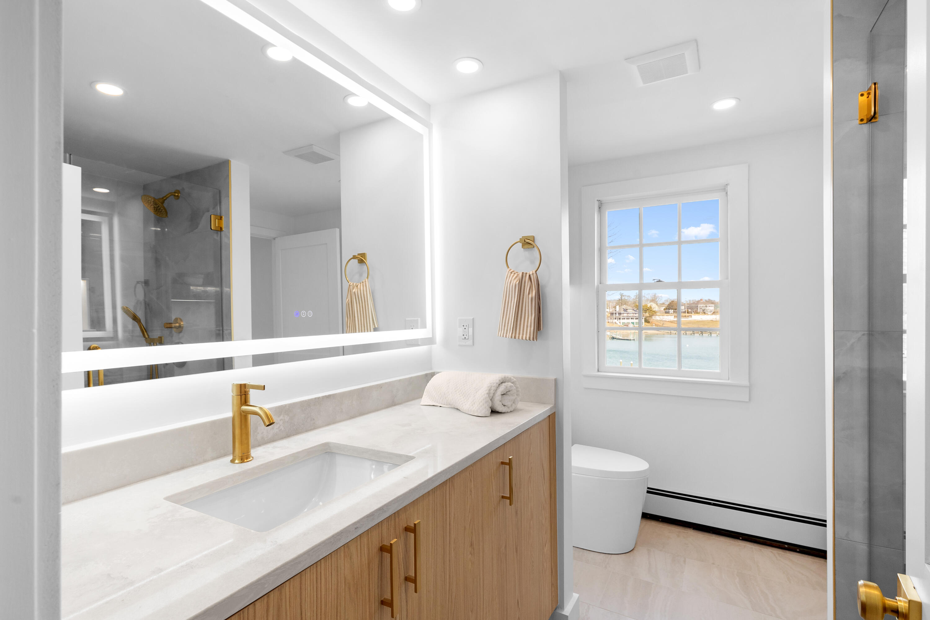 8 Pine Tree Drive Wareham, MA 02532 - Photo 25 of 36 a bathroom with a sink and a mirror with toilet