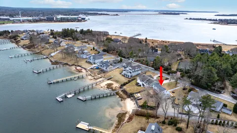 an aerial view of a house with a lake view