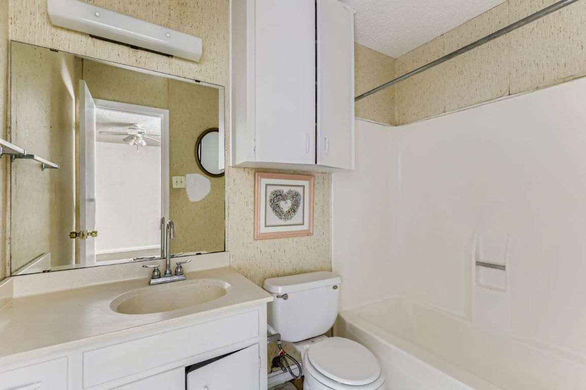 111 Stubblefield Drive Elgin, TX 78621 - Photo 15 of 27 a bathroom with a sink and a mirror
